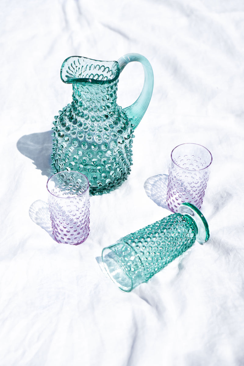 Beryů Square Jug and Lilac Tumblers are standing on the white Canvas