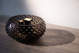 Black smoke hobnail bowl on the wooden table: